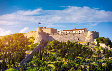 Obraz premium The Fortica fortress (Spanish Fort or Spanjola Fortres) on the Hvar island in Croatia. Ancient fortress on Hvar island over town (citadel), popular touristic attraction of Adriatic coast, Croatia.