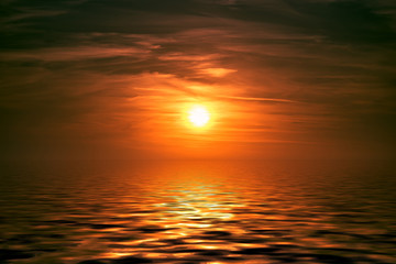 Naklejka na ściany i meble Seascape with a beautiful sunset over the water.
