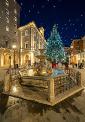 Rieti (Italy) - The historic center of the Sabina's provincial capital, under Mount Terminillo with snow and crossed by the river Velino, during the Christmas holidays