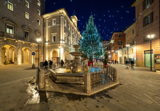 Rieti (Italy) - The historic center of the Sabina's provincial capital, under Mount Terminillo with snow and crossed by the river Velino, during the Christmas holidays