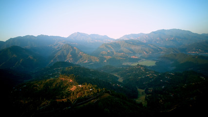 Fototapeta premium Orange sunrise above mountain in valley Himalayas mountains
