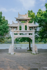A paifang, a traditional Chinese arch, near water, in the Maojiabu area of West Lake, Hangzhou, China