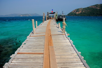 Koh kham small island and wood bridge on the beach with blue sky and clear water. Koh kham pattaya thailand. 