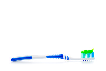 toothbrush and toothpaste on an isolated background