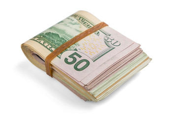 stack of cash dollars, bent in half, under the elastic band is isolated on a white background. Close-up.