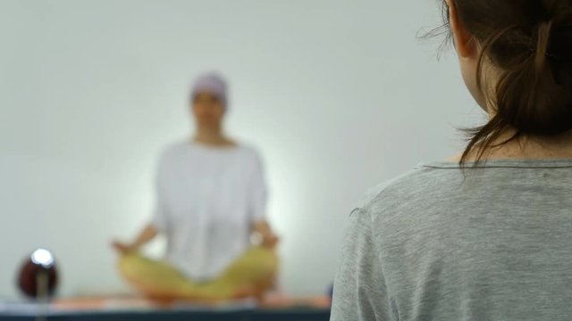 A group of women doing kundalini yoga