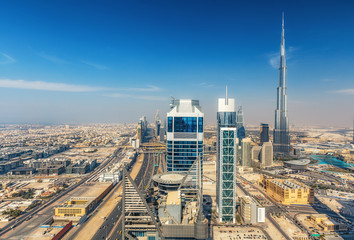 Aerial view on downtown Dubai, UAE. Skyscrapers of the business bay on a summer day.