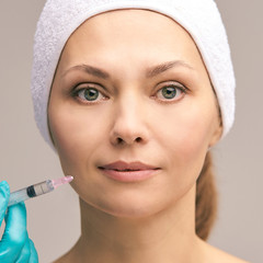 Facial injecting treatment. Skin platelet. Prp rich plasma injection. Beauty woman. Doctor gloves