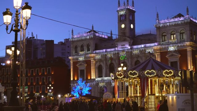 City hall and old vintage carousel at Christmas night, Valladolid, Spain 2018