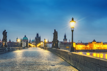 Fototapeta na wymiar Charles bridge in Prague, Czech republic, at nighttime. Beautiful travel background.