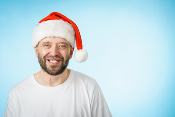 Smiling man in santa claus hat portrait