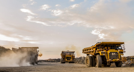 Mining dump trucks transporting Platinum ore for processing © Sunshine Seeds