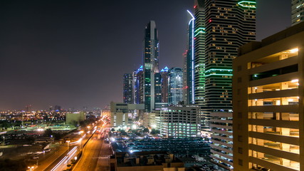 Downtown Dubai towers night timelapse. Aerial view of Sheikh Zayed road with skyscrapers.