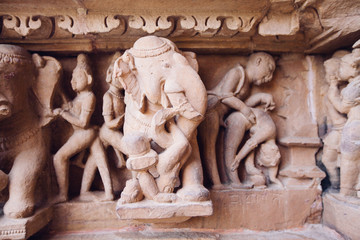 Fototapeta na wymiar Ancient bas-relief at famous erotic temple in Khajuraho, India.