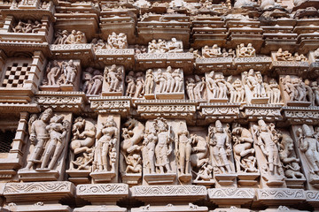 Ancient bas-relief at famous erotic temple in Khajuraho, India.