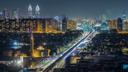 Obraz premium Jumeirah Palm island skyline night timelapse in Dubai, UAE.