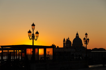 Naklejka na ściany i meble silhouette of the Basilica of Santa Maria della Salute at sunset in Venice