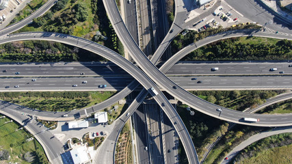 Aerial photo of multilevel elevated highway junction highway passing through modern city in...