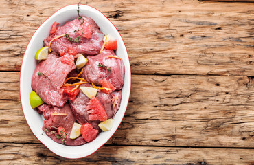 Pieces of raw beef steaks.Raw sliced meat.Citrus marinade