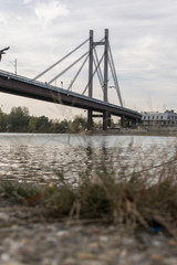 Fototapeta na wymiar Riverside view, boat, river, bridge