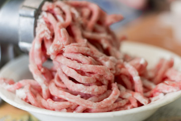 minced meat twisted on a meat grinder, selective focus