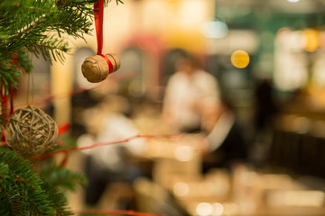 horizontal image with detail of a cork used as Christmas decoration in a restaurant