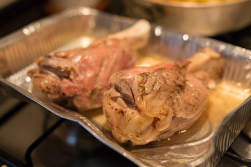 horizontal image with close up detail of a baked pork shank