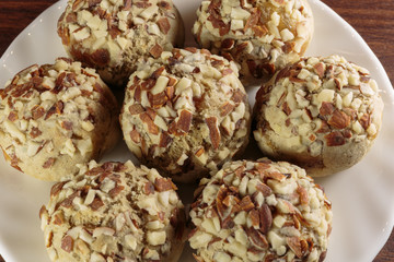 Traditional oriental ginger cookies on the wooden table.  Gingerbread with nuts, almonds, sage and saffron.