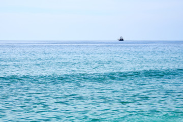 Naklejka premium Pirate ship on the horizon. Copy space. 