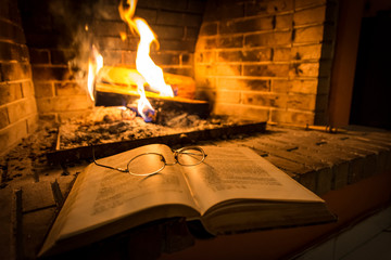 open book beside fireplace