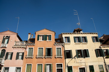 Fototapeta na wymiar Facade of old houses, Venice, Italy. Detail on Venetian houses.