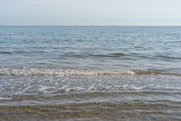 View of the sea from the beach on a spring day