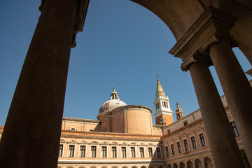 Venice, Italy, Church of San Giorgio on the island of San Giorgio Maggiore. Detail of the bell tower and dome, seen from the cloister of the Cini foundation.