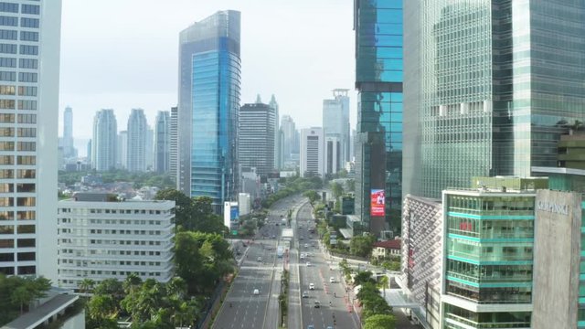 JAKARTA, Indonesia - December 28, 2018: Aerial landscape of Sudirman street and Selamat Datang Monument or Welcome Monument in Hotel Indonesia Roundabout. Shot in 4k resolution