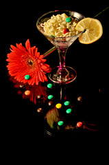 glass with champagne and fireworks