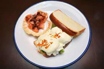 Breakfast poached eggs with salmon carpaccio closeup