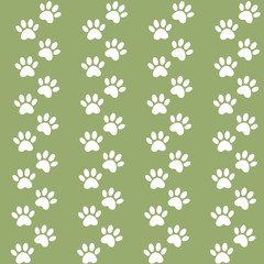 Fototapeta na wymiar Traces of cat textile pattern. Vector seamless paw print seamless pattern. green background for packing design