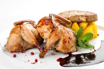 Quail with berry sauce. On white background