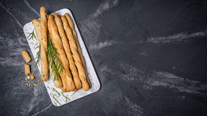 Top view of traditional italian appetizer grissini with rosemary spice