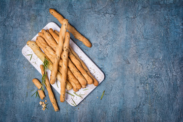Top view of traditional italian appetizer grissini with rosemary spice