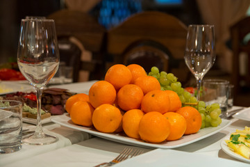 tangerines and grapes on the holiday table