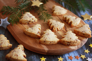 Christmas pastry tree with chocolate on wooden baord, close up