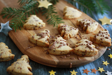 Christmas pastry tree with chocolate on wooden baord, close up
