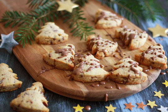 Christmas pastry tree with chocolate on wooden baord, close up