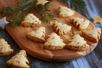 Christmas pastry tree with chocolate on wooden baord, close up