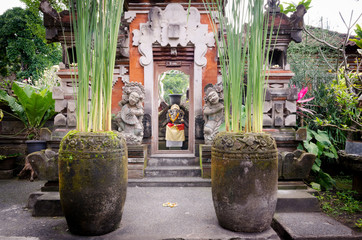 Traditional Bali temple home entrance gate in a garden