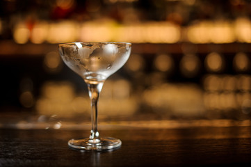 Empty misted cocktail glass for alcoholic drink