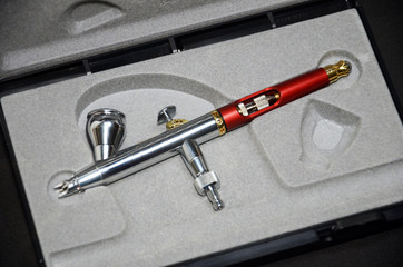 Airbrush tip detail. Needle tip of an airbrush. Approximate view of technical detail.