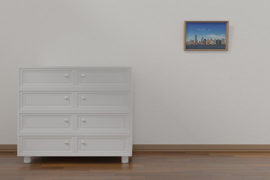 A white drawer in the neat room with a painting