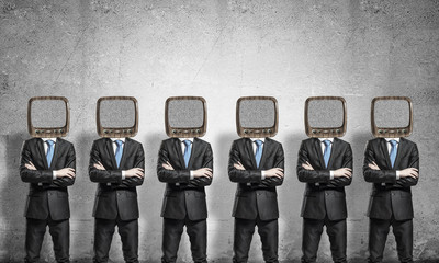Businessmen with old TV instead of head.